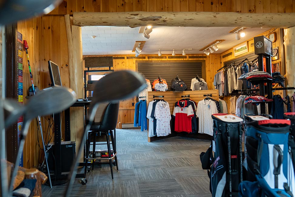 Inside of retail store with golf shirts on display