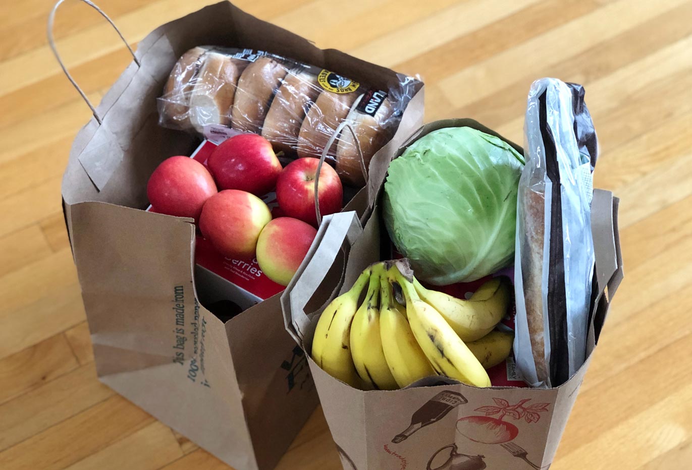 paper bags full of fresh groceries