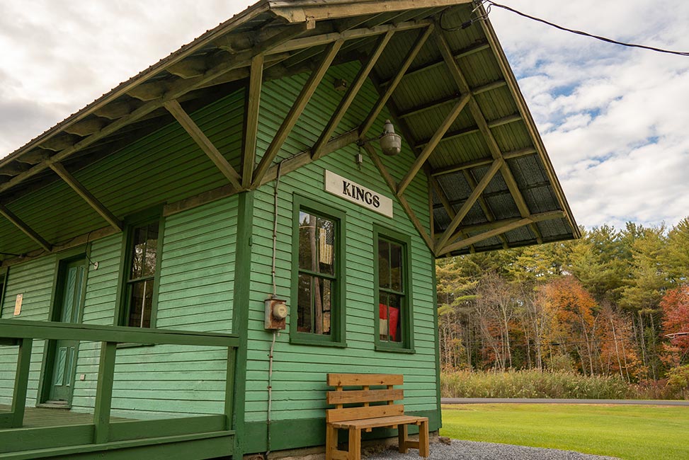 train station exterior with sign labeled "kings station"