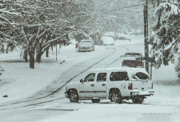 vehicles driving on a snowy road