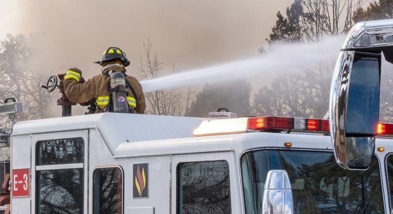 figherfighters blasting water hose